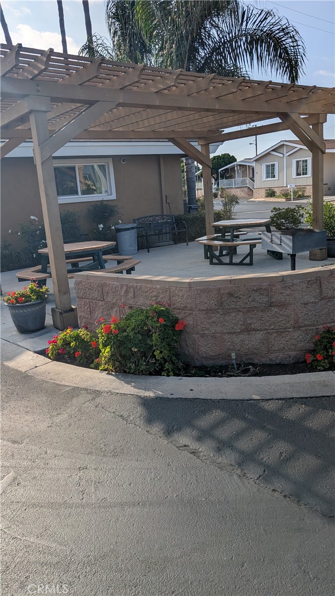 3424 West Washington Avenue, Unit 228 Santa Ana, CA 92703 - Photo 28 of 31 a front view of a house with a yard