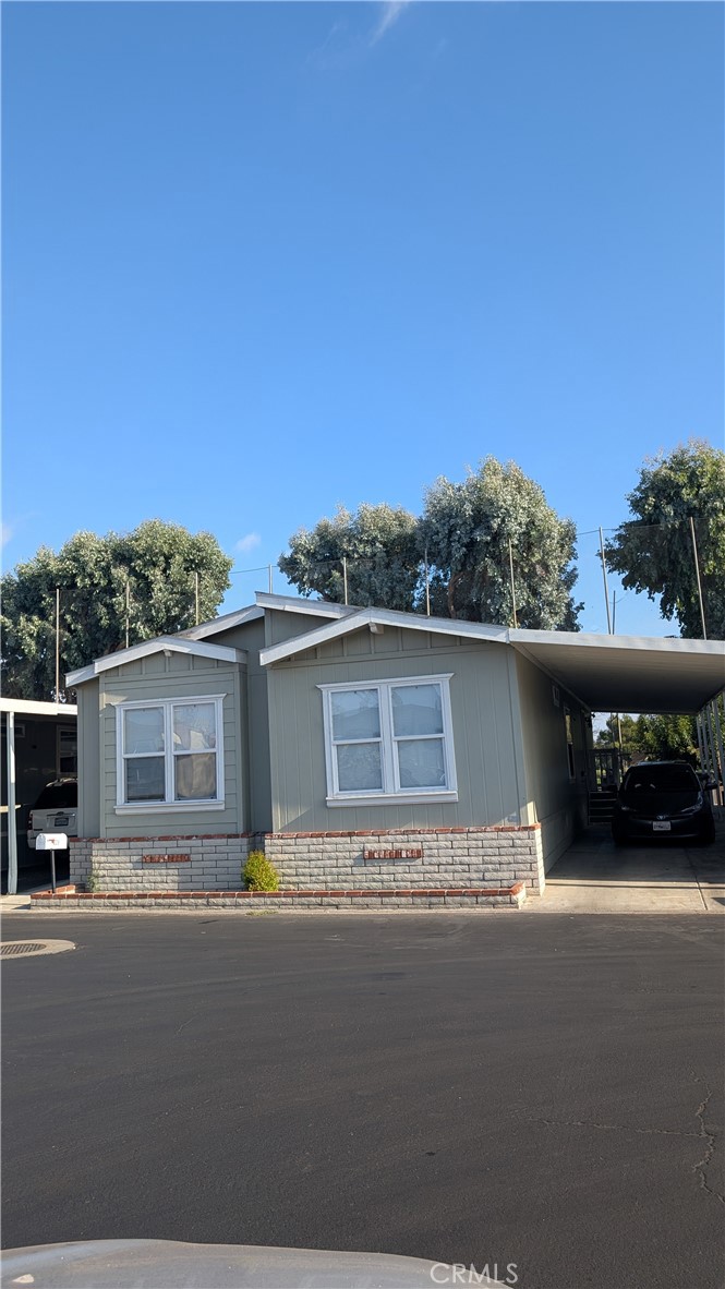 3424 West Washington Avenue, Unit 228 Santa Ana, CA 92703 - Photo 30 of 31 a view of street with a car parked in front of it