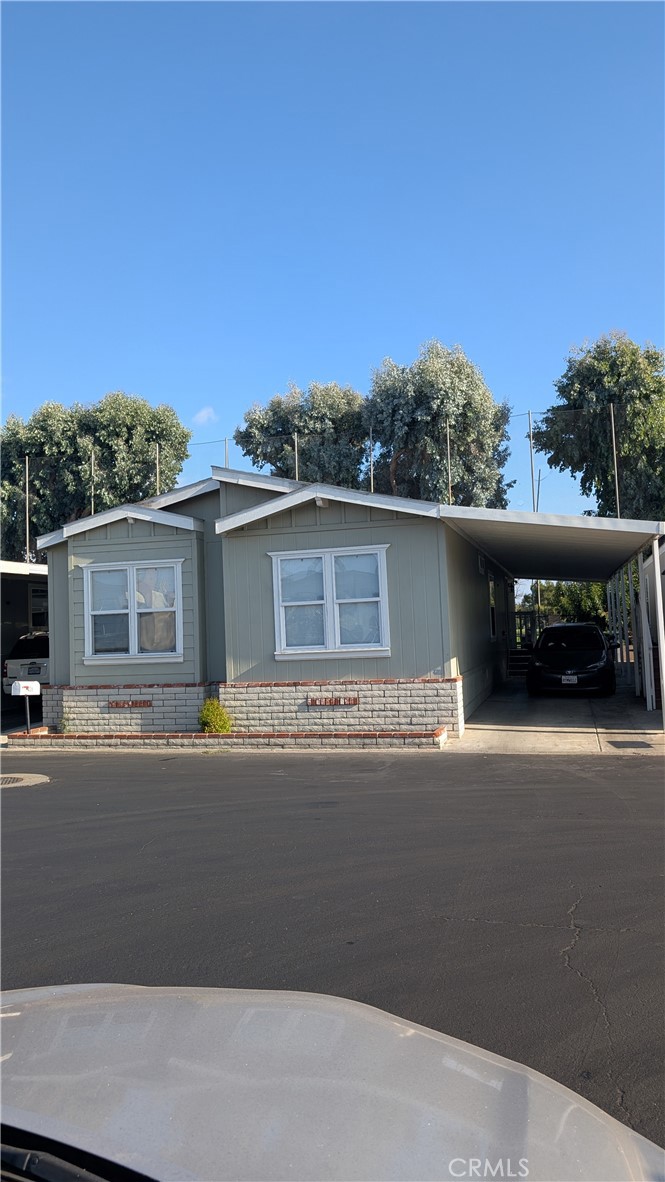 3424 West Washington Avenue, Unit 228 Santa Ana, CA 92703 - Photo 31 of 31 front view of a house with a street
