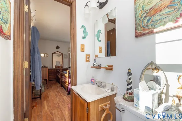 a bathroom with a sink mirror and a bath tub