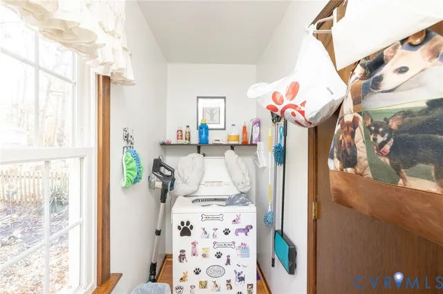 a vase of flowers sitting on a table in front of a window