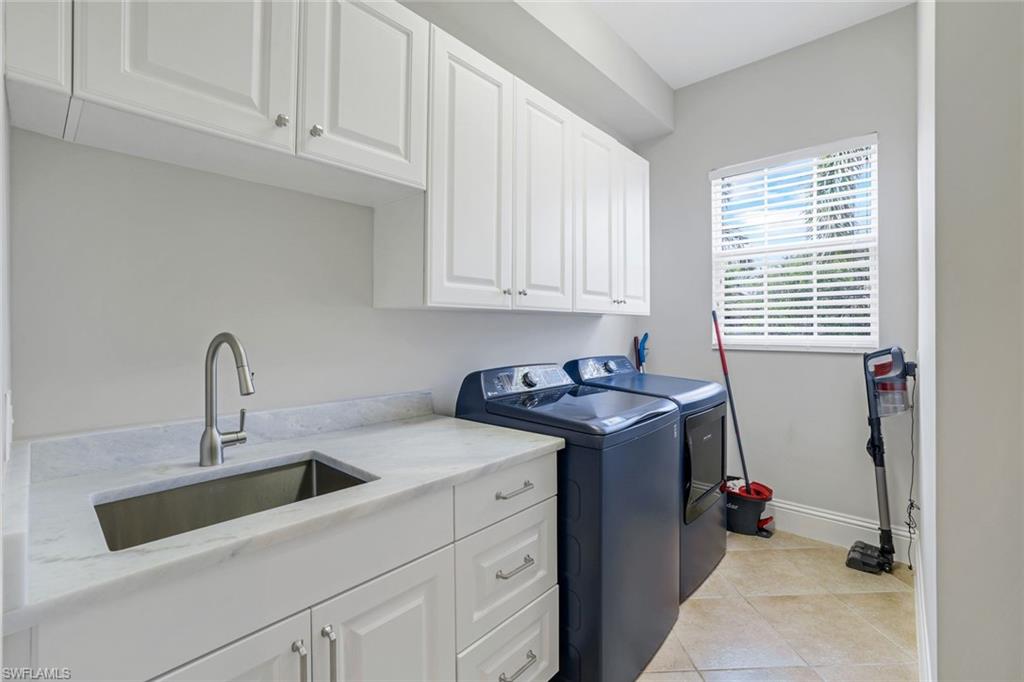 9053 Cascada Way, Unit 202 Naples, FL 34114 - Photo 22 of 45 a utility room with sink dryer and washer