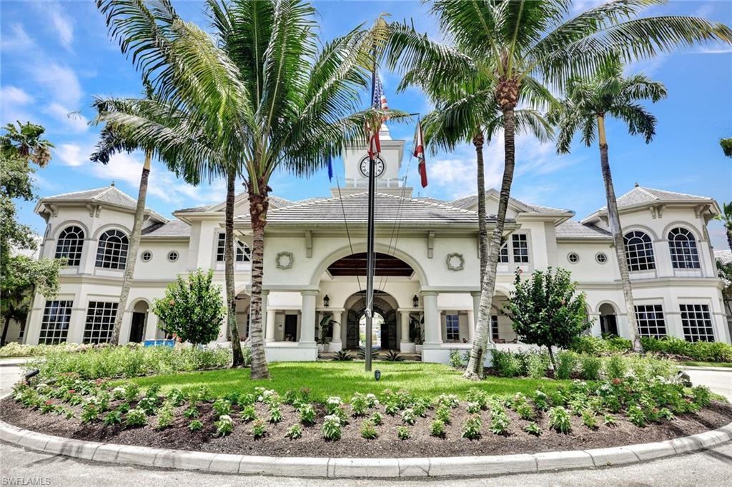 9053 Cascada Way, Unit 202 Naples, FL 34114 - Photo 25 of 45 a front view of a house with a garden