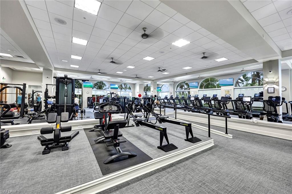 9053 Cascada Way, Unit 202 Naples, FL 34114 - Photo 33 of 45 a view of a room with lots of gym equipment
