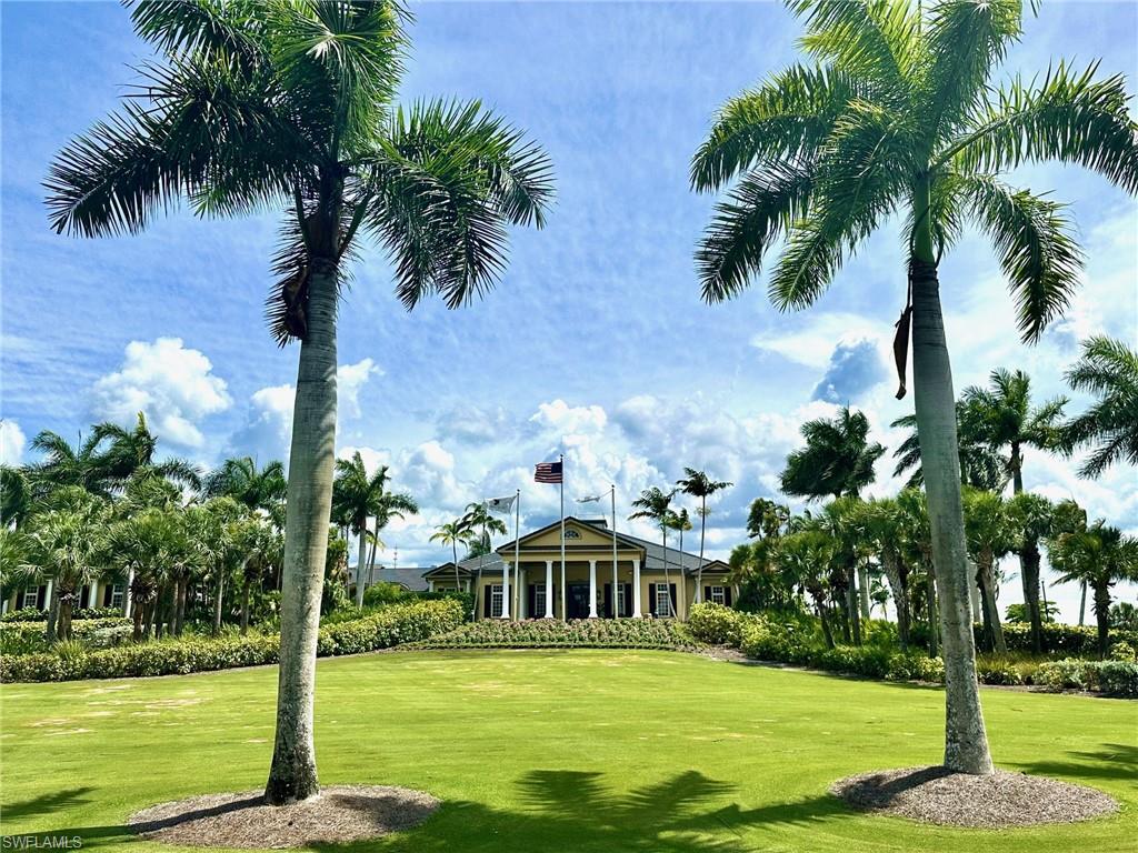 9053 Cascada Way, Unit 202 Naples, FL 34114 - Photo 41 of 45 a front view of a house with a yard