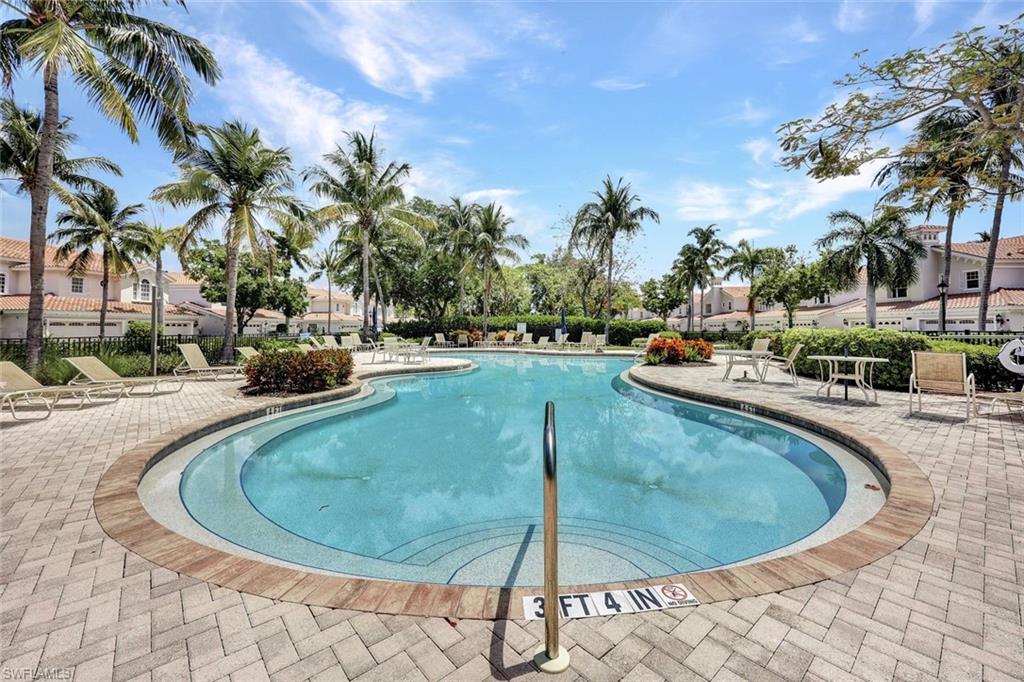 9053 Cascada Way, Unit 202 Naples, FL 34114 - Photo 44 of 45 a view of a swimming pool with outdoor seating