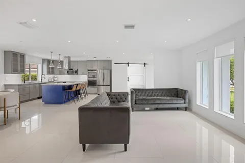 a kitchen with refrigerator and cabinets