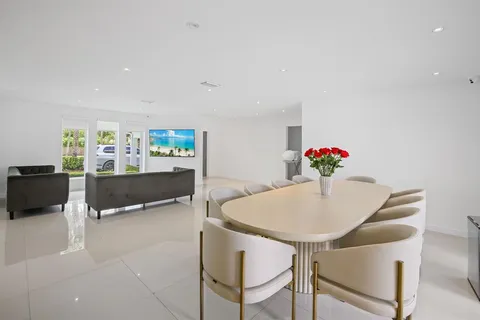 a living room with furniture and flowers