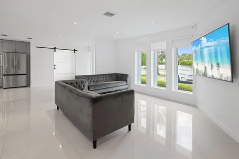 a kitchen with stainless steel appliances granite countertop a sink and a stove