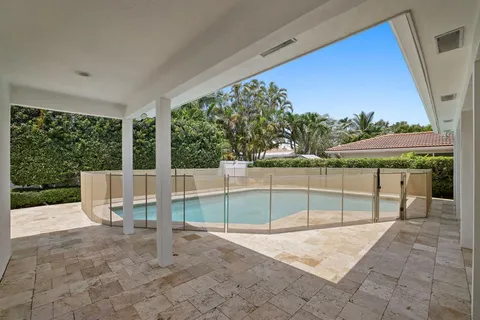 a view of a swimming pool with a patio