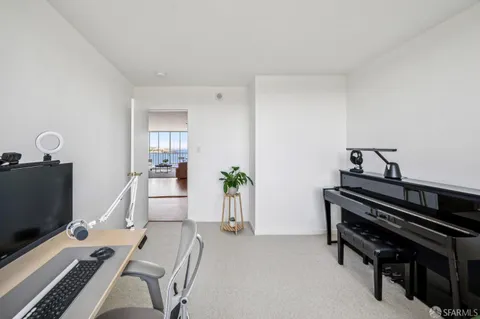a bedroom with furniture and a window