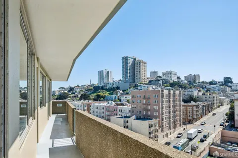 a city view from a balcony with city view