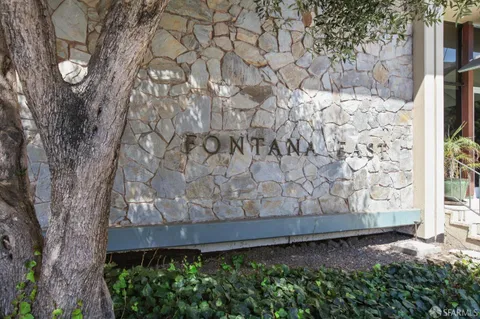 a front view of a building with outdoor space