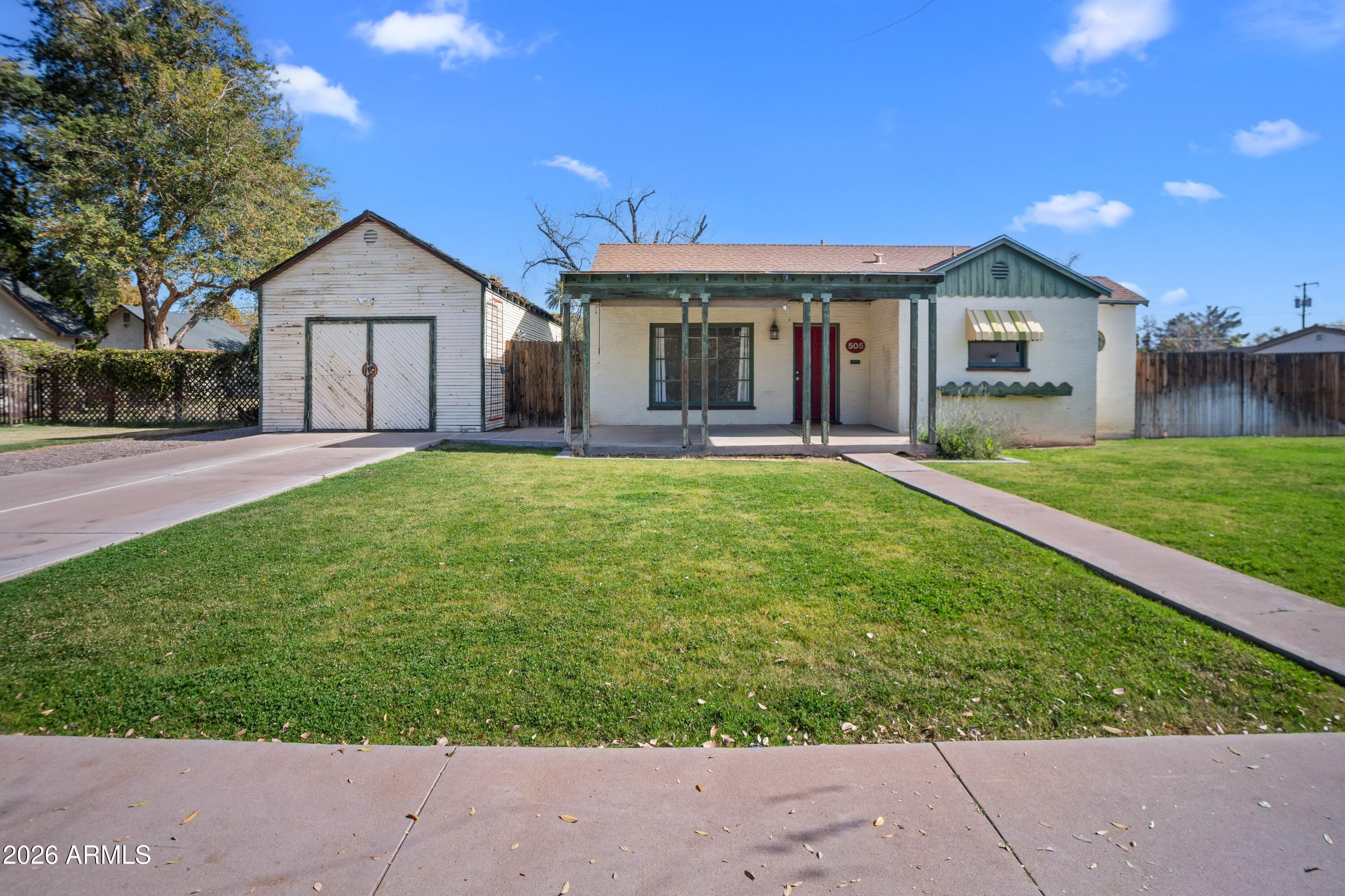 505 North Robson Mesa, AZ 85201 - Photo 1 of 27 a front view of a house with a yard and garage