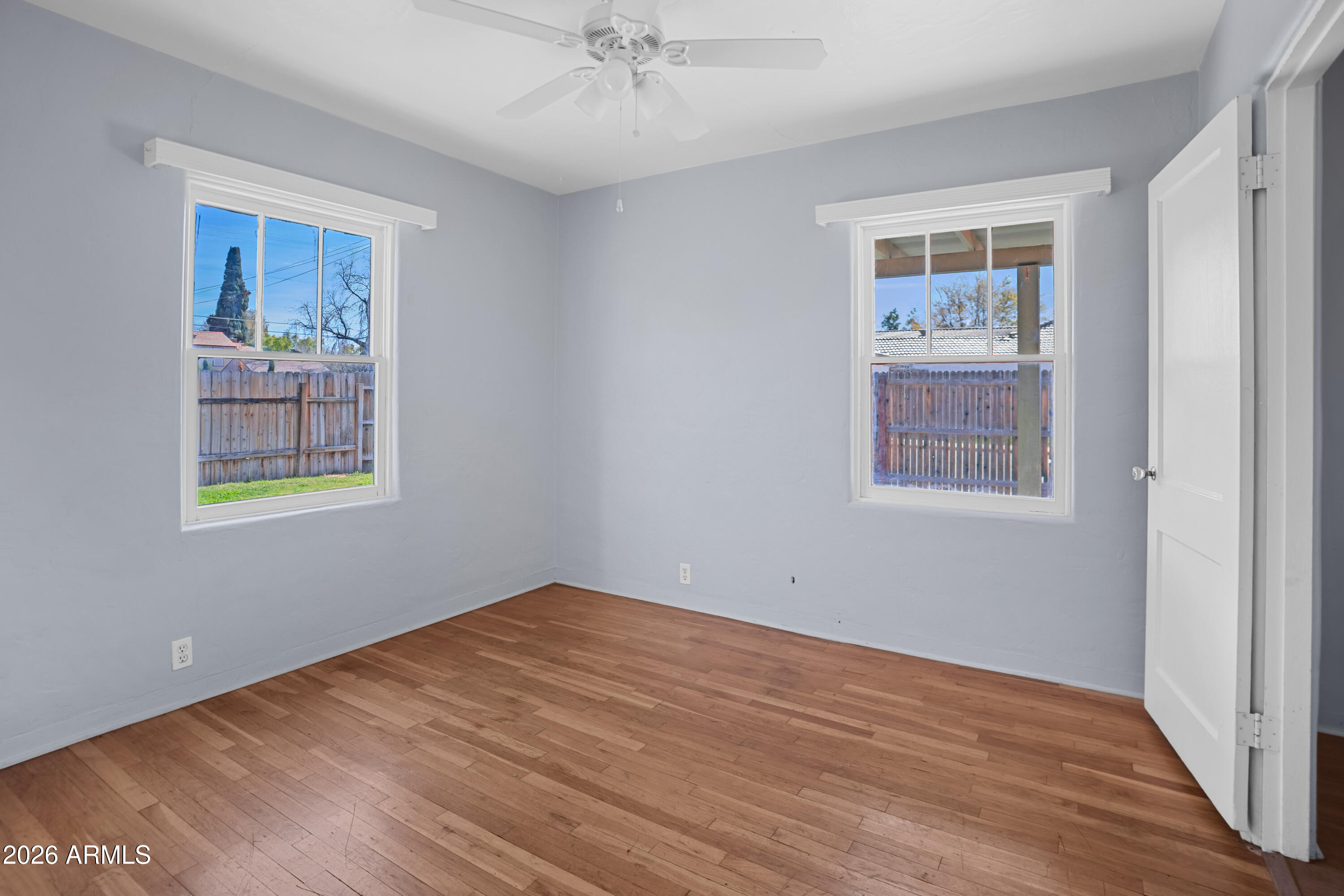 505 North Robson Mesa, AZ 85201 - Photo 10 of 27 a view of an empty room with a window and wooden floor