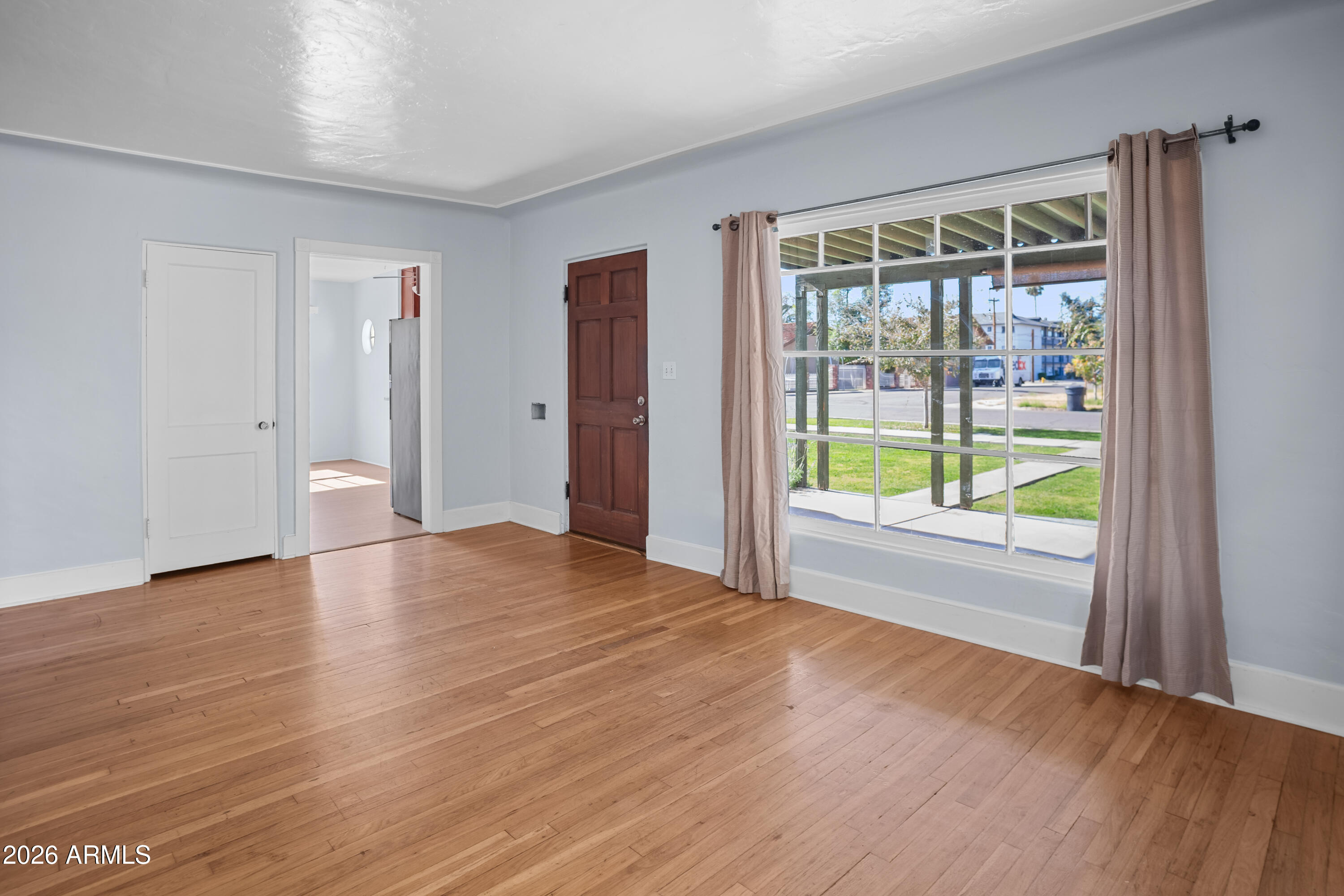 505 North Robson Mesa, AZ 85201 - Photo 5 of 27 a view of an empty room with wooden floor and a window