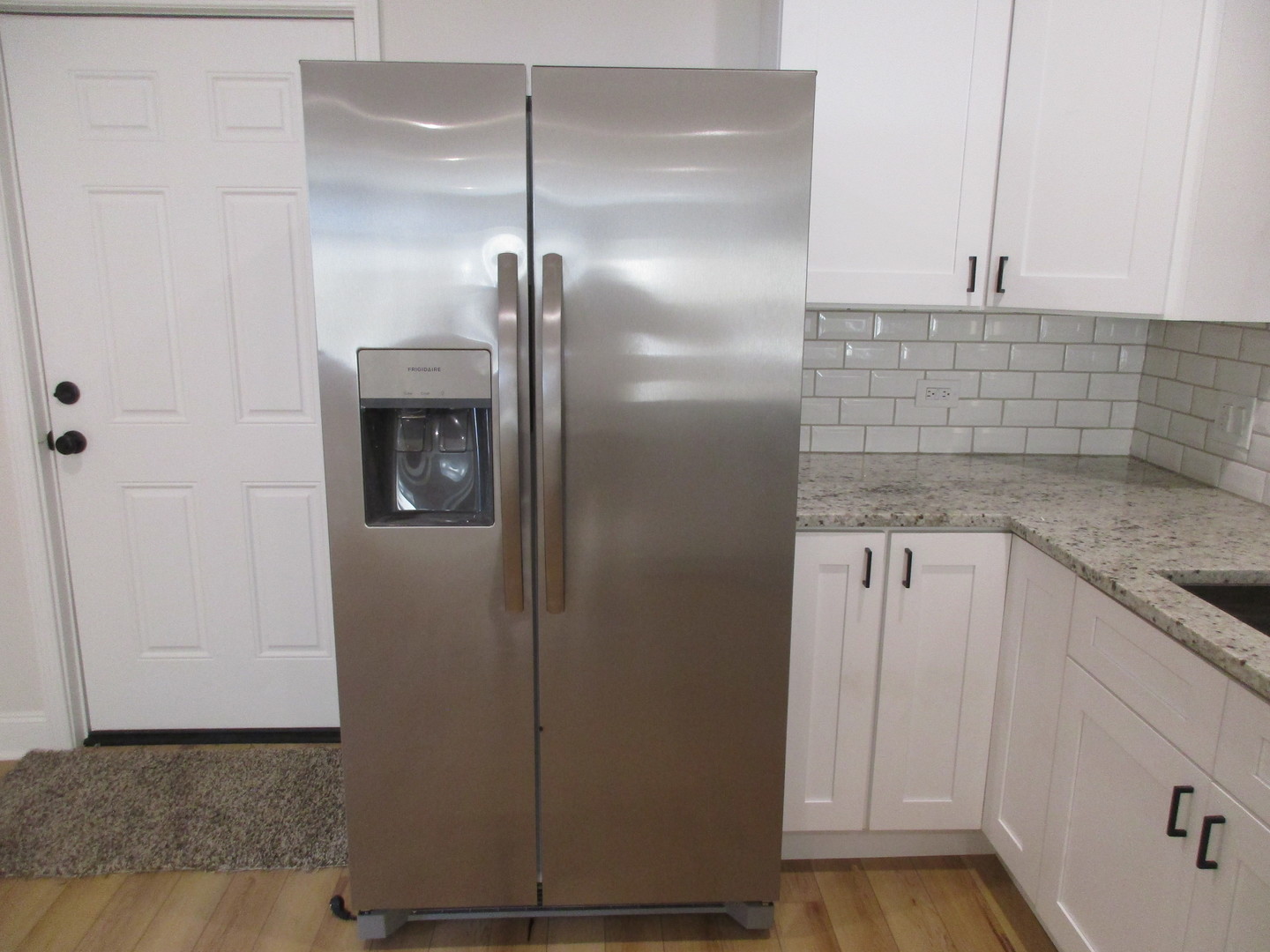 1134 West 104th Street Chicago, IL 60643 - Photo 17 of 53 a view of a refrigerator in kitchen and white cabinets