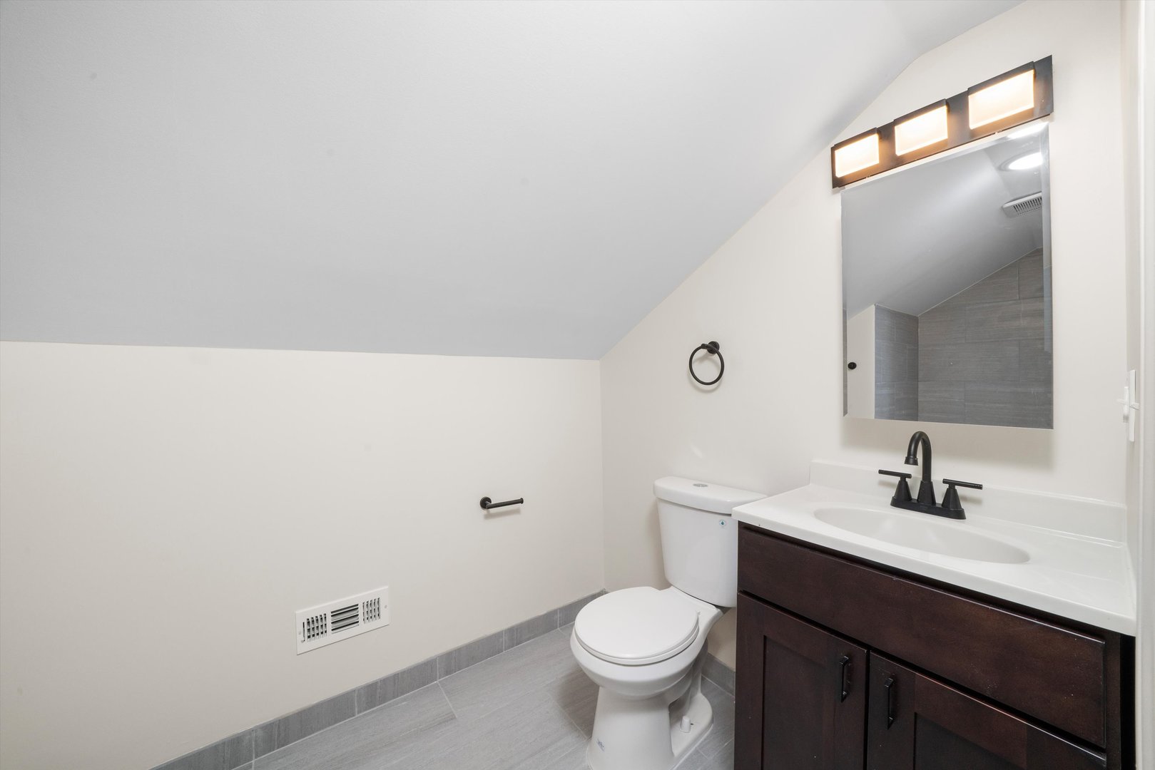 1134 West 104th Street Chicago, IL 60643 - Photo 24 of 53 a bathroom with a sink and a toilet