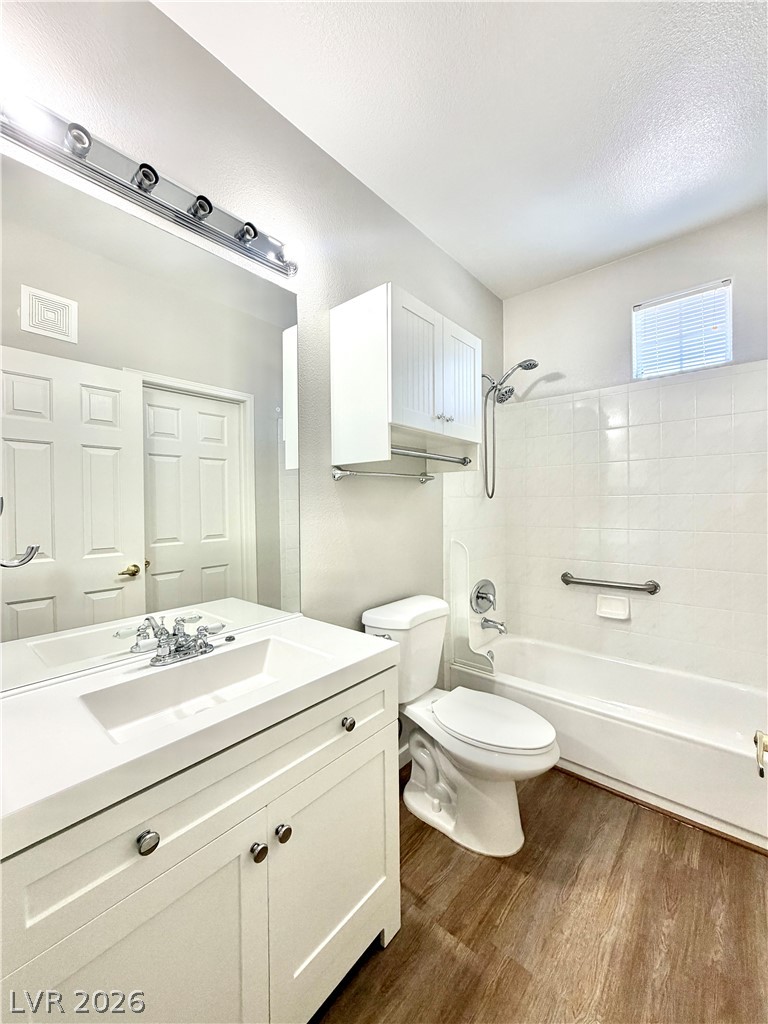 8555 West Russell Road, Unit 2018 Las Vegas, NV 89113 - Photo 19 of 23 A well-appointed bath features a sleek vanity and a combination shower-tub for daily rejuvenation.