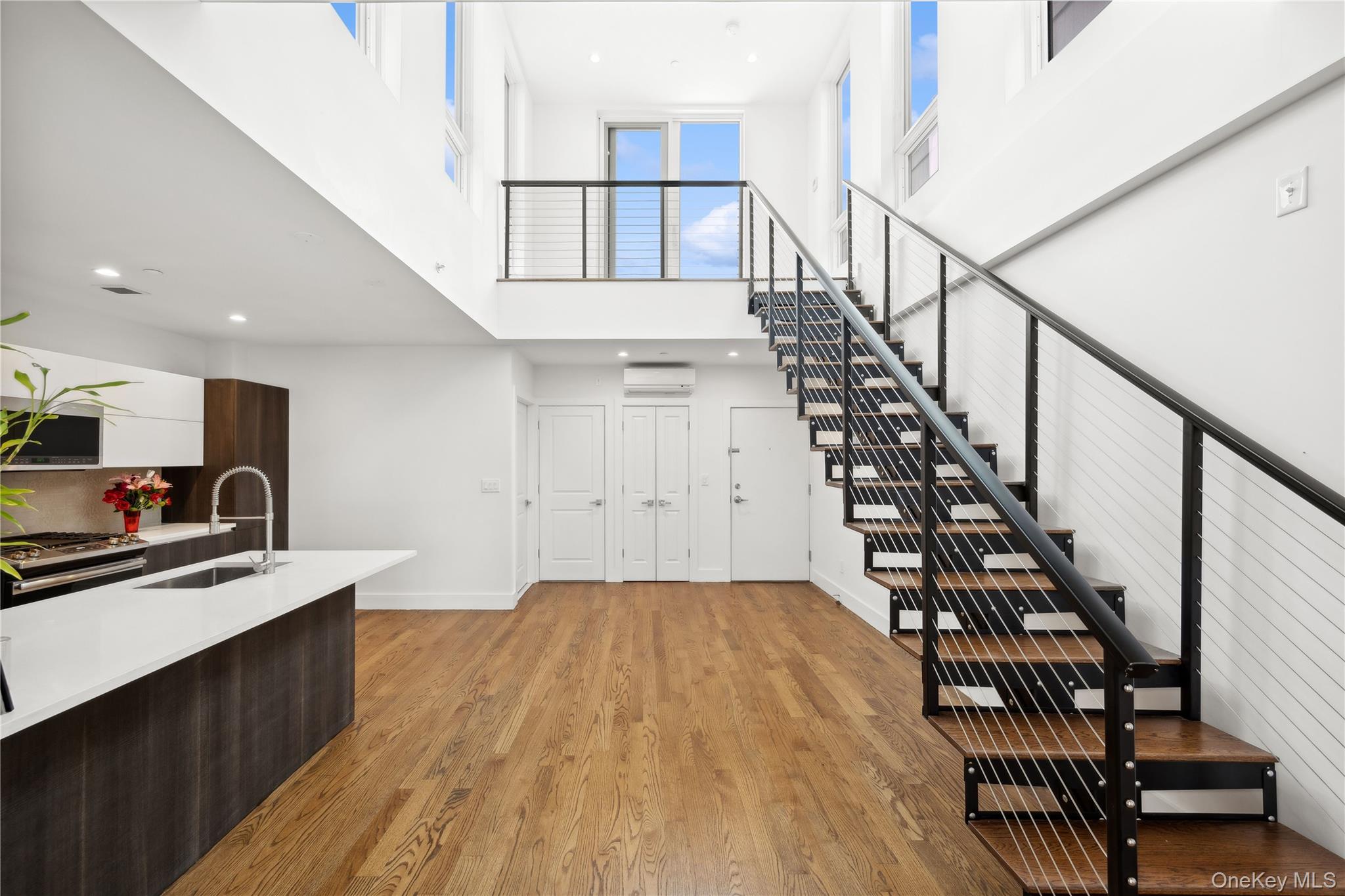 109-19 72nd Road, Unit PH7F Queens, NY 11375 - Photo 6 of 27 a view of kitchen with sink and wooden floor