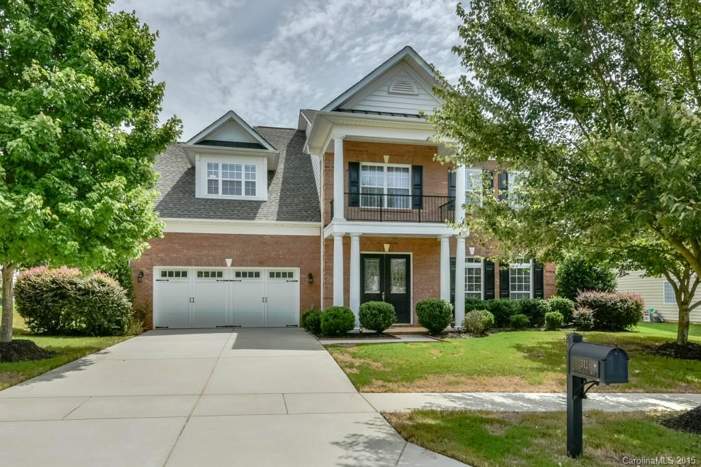 312 Miners Cove Way Fort Mill, SC 29708 - Photo 1 of 24 a front view of house with yard and green space