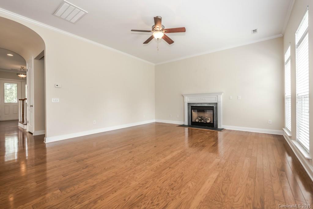 312 Miners Cove Way Fort Mill, SC 29708 - Photo 11 of 24 wooden floor in an empty room with a window
