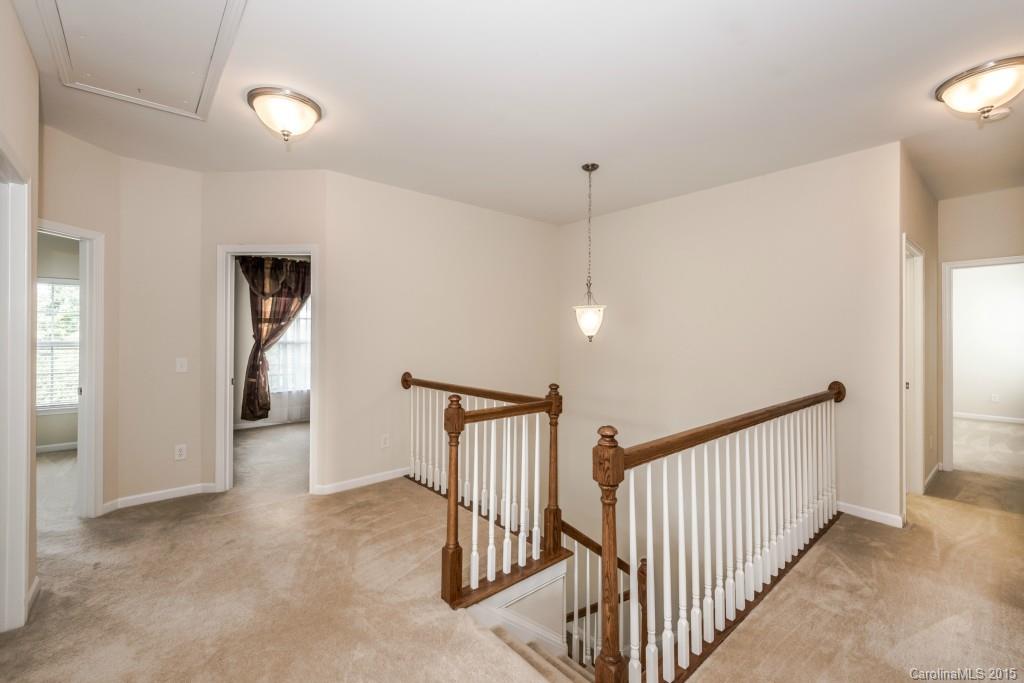 312 Miners Cove Way Fort Mill, SC 29708 - Photo 13 of 24 a view of a hallway with entryway and stairs