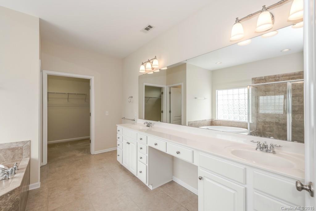 312 Miners Cove Way Fort Mill, SC 29708 - Photo 16 of 24 a bathroom with a double vanity sink mirror and