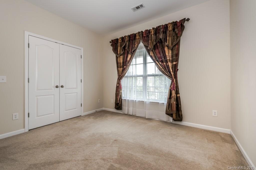 312 Miners Cove Way Fort Mill, SC 29708 - Photo 18 of 24 an empty room with windows