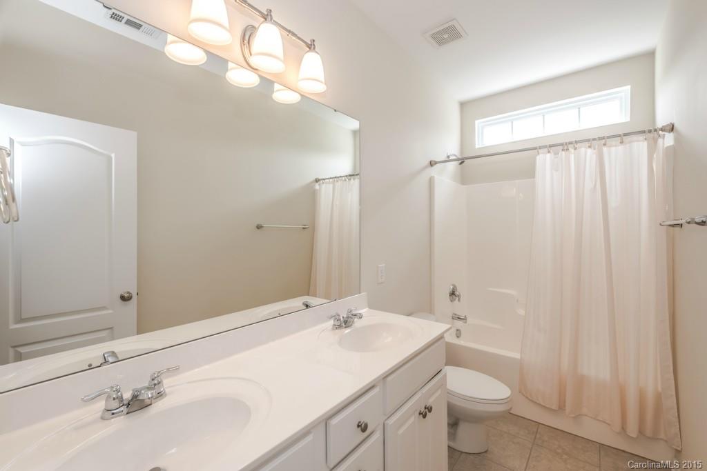 312 Miners Cove Way Fort Mill, SC 29708 - Photo 20 of 24 a bathroom with a sink toilet and shower