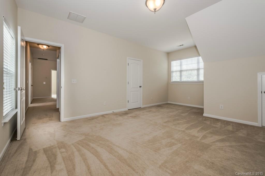 312 Miners Cove Way Fort Mill, SC 29708 - Photo 22 of 24 an empty room with windows and closet