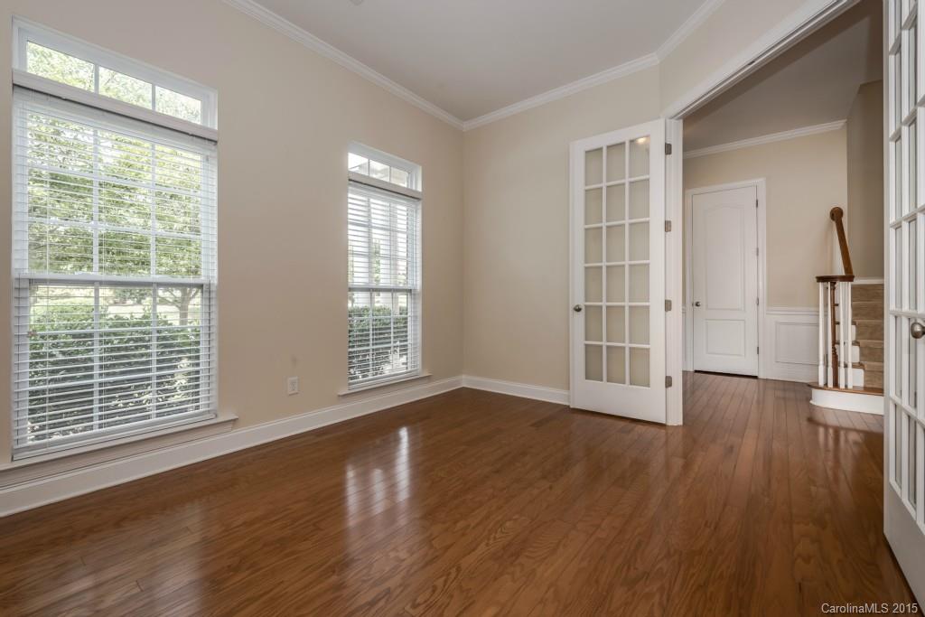 312 Miners Cove Way Fort Mill, SC 29708 - Photo 4 of 24 a view of an empty room with wooden floor and a window