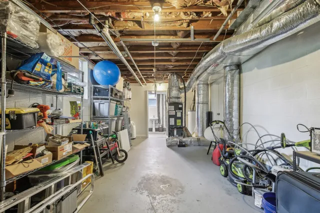 a view of a field with trees in the background