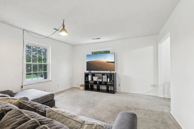 a view of a room that has a table and a chair