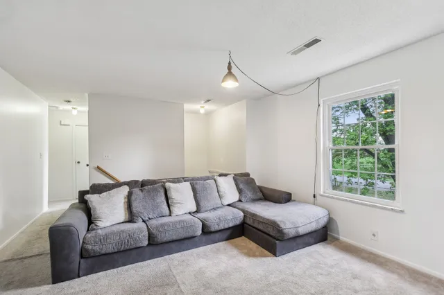 a living room with furniture and a couch