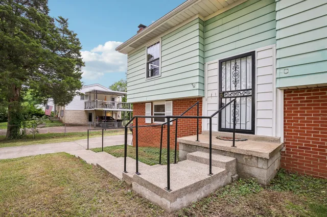 a view of a house with wooden fence