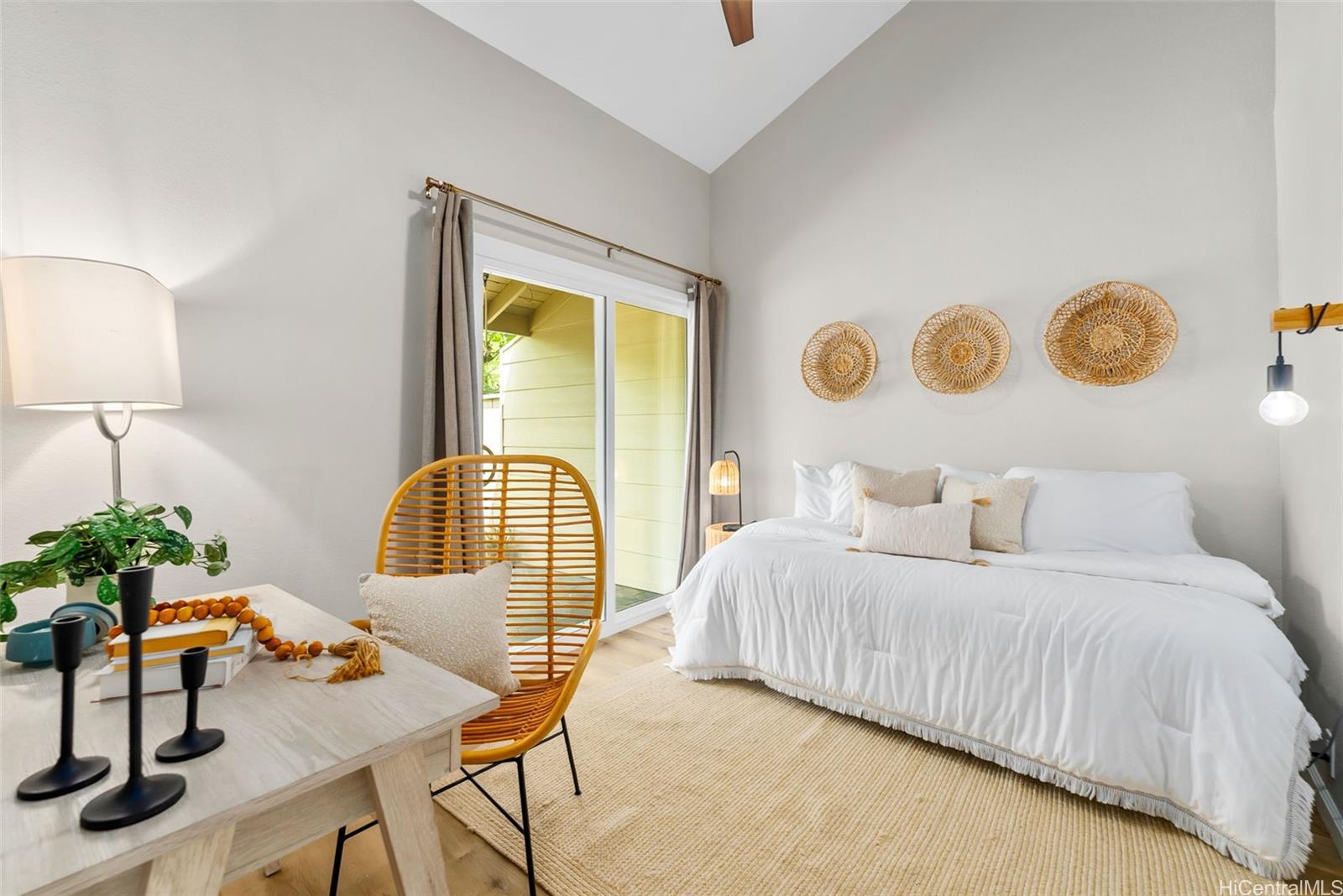 45-995 Wailele Road, Unit 55 Kaneohe, HI 96744 - Photo 13 of 24 a bedroom with a bed and dresser with potted plants next to a window