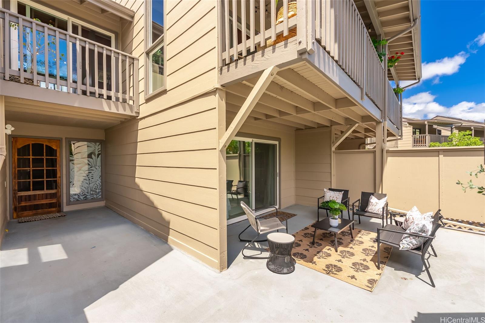 45-995 Wailele Road, Unit 55 Kaneohe, HI 96744 - Photo 18 of 24 a view of a patio with table and chairs and potted plants
