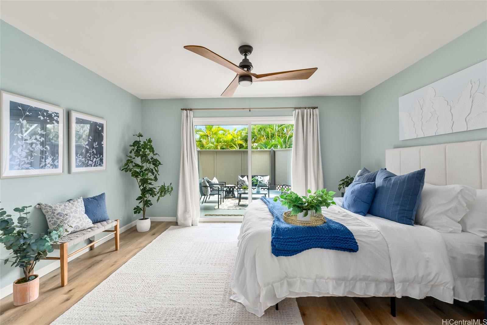 45-995 Wailele Road, Unit 55 Kaneohe, HI 96744 - Photo 10 of 24 a bedroom with a bed and a large window