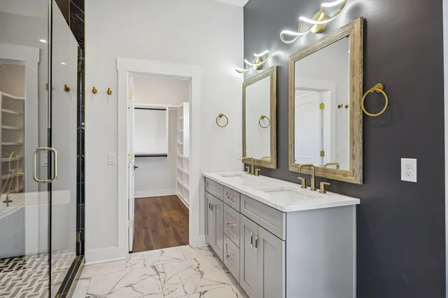 a kitchen with kitchen island a sink stove top oven and cabinets