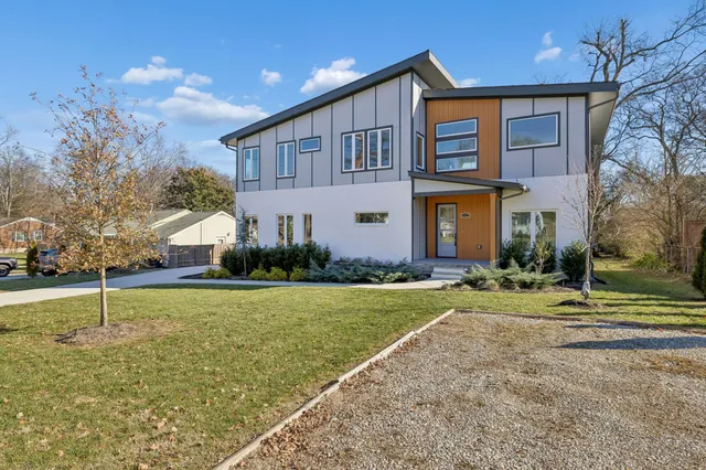 a kitchen with kitchen island a counter space a sink appliances and cabinets