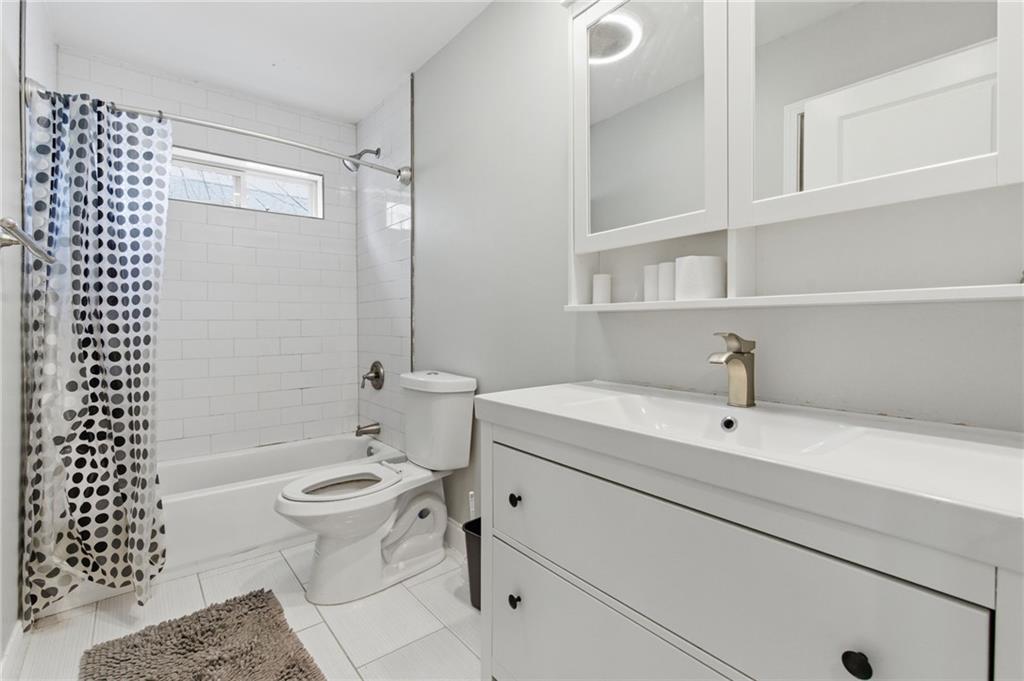 1690 Ware Avenue Atlanta, GA 30344 - Photo 14 of 25 a bathroom with a sink toilet and shower