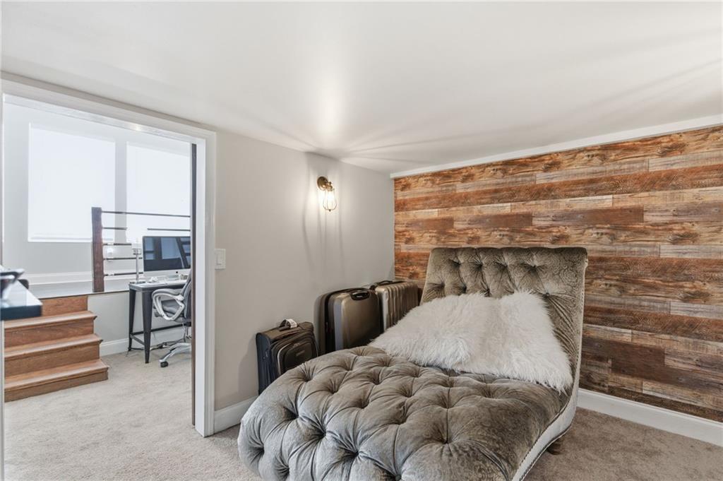 1690 Ware Avenue Atlanta, GA 30344 - Photo 17 of 25 a bedroom with a bed and lamp