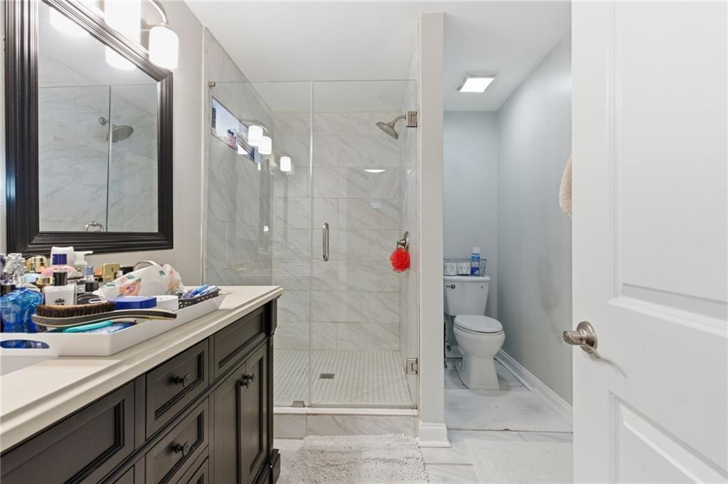 1690 Ware Avenue Atlanta, GA 30344 - Photo 20 of 25 a bathroom with a sink and a mirror with toilet