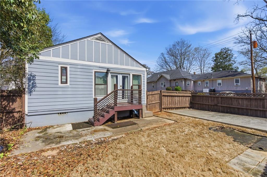 1690 Ware Avenue Atlanta, GA 30344 - Photo 22 of 25 a view of a house with a yard and roof