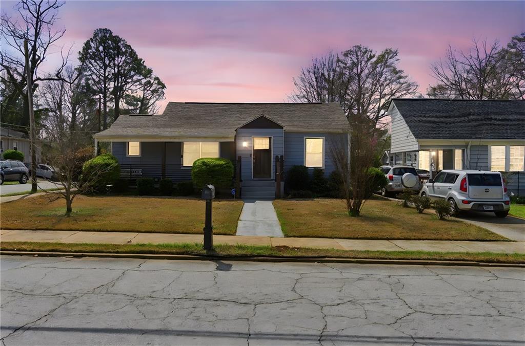 1690 Ware Avenue Atlanta, GA 30344 - Photo 25 of 25 a front view of a house with garden