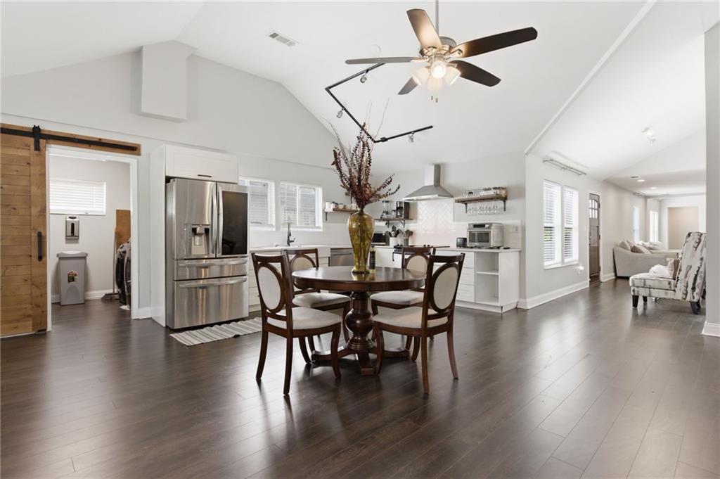 1690 Ware Avenue Atlanta, GA 30344 - Photo 4 of 25 a view of a dining room with furniture and wooden floor