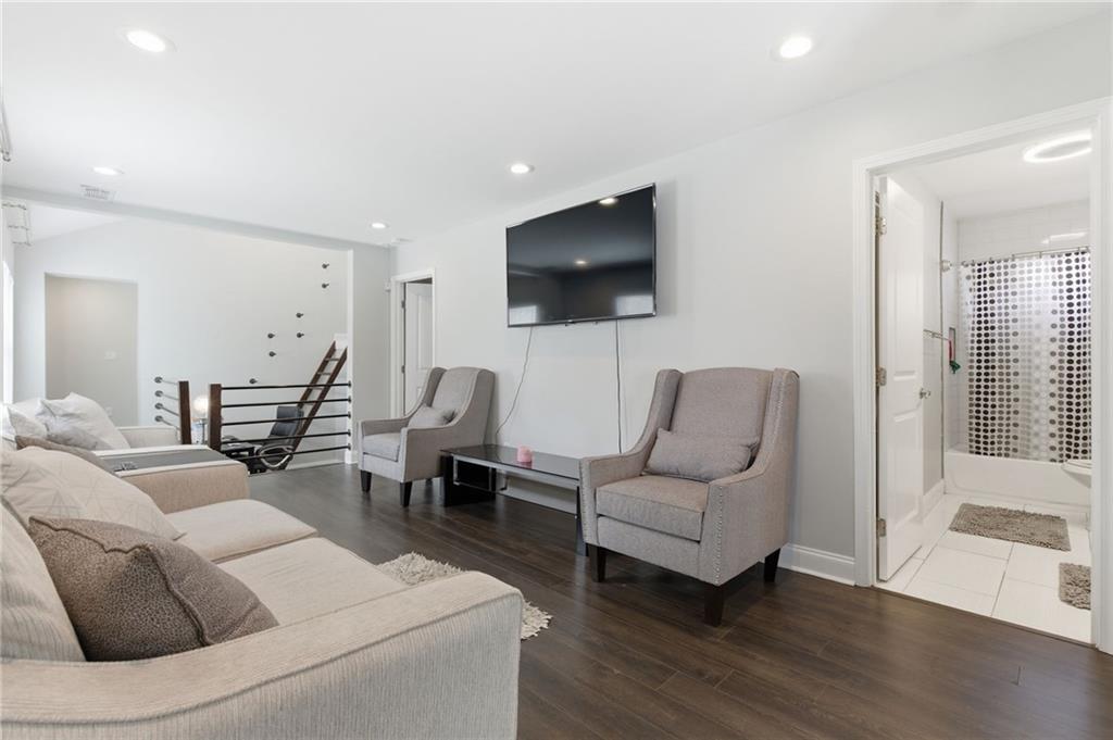 1690 Ware Avenue Atlanta, GA 30344 - Photo 7 of 25 a living room with furniture and a flat screen tv