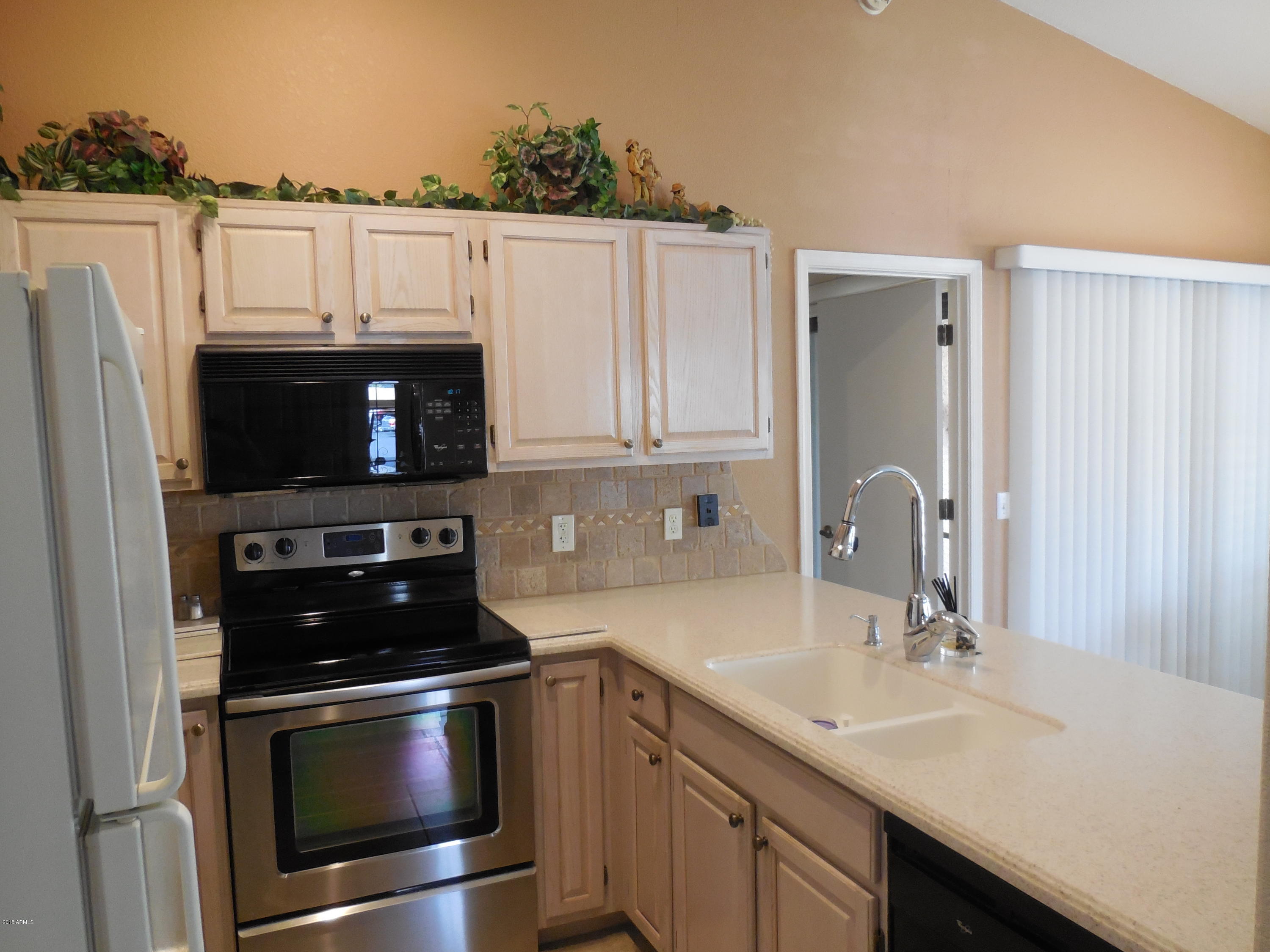 14300 West Bell Road, Unit 309 Surprise, AZ 85374 - Photo 17 of 37 U-Shaped Kitchen