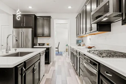 a kitchen with a stove and a sink